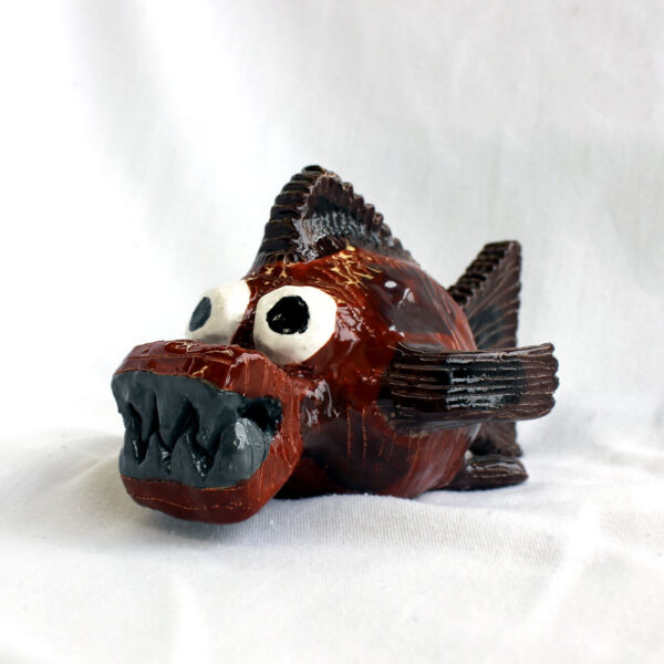 Brown and grey piranha sculpture by Amber Tyreman