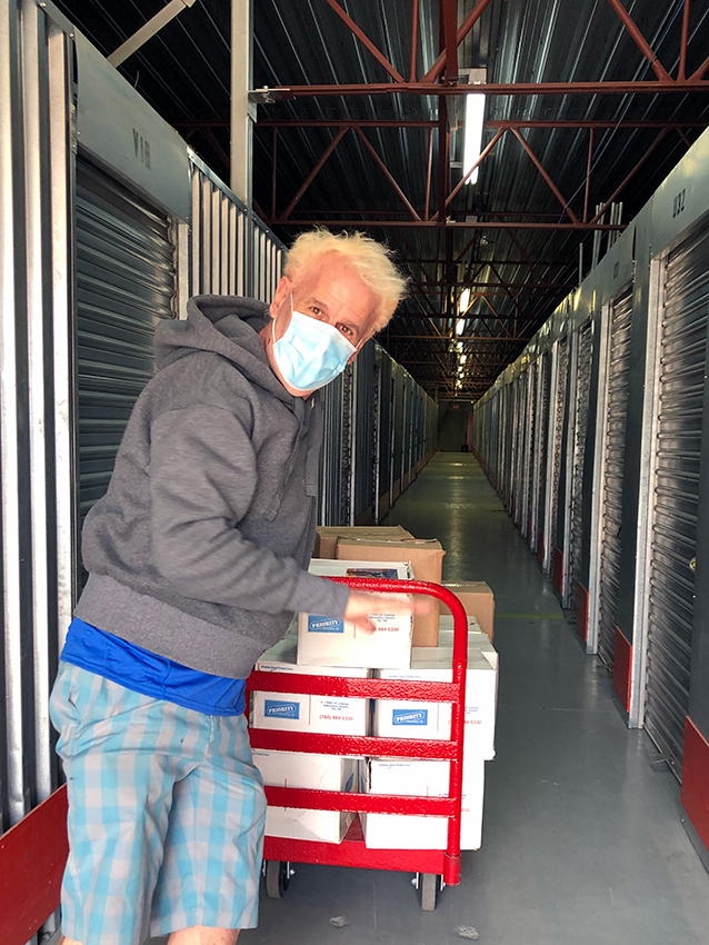 Darren with a cart of boxes at Sentinel Storage