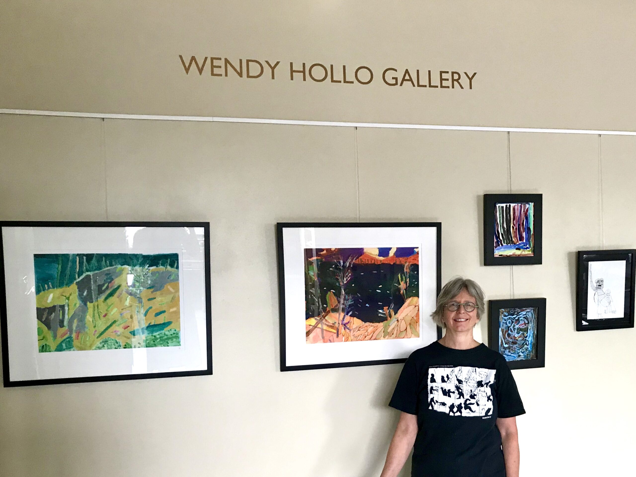 Wendy in front of the newly named "Wendy Hollo Gallery"