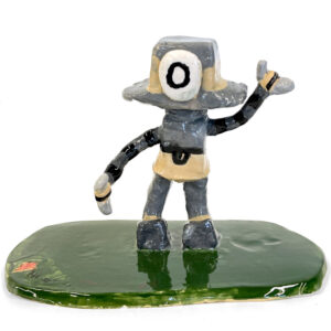 Sculpture of a robot on a green base