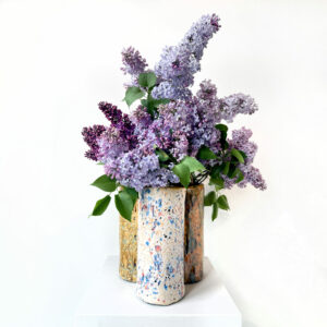 Ceramic vase full of lilacs