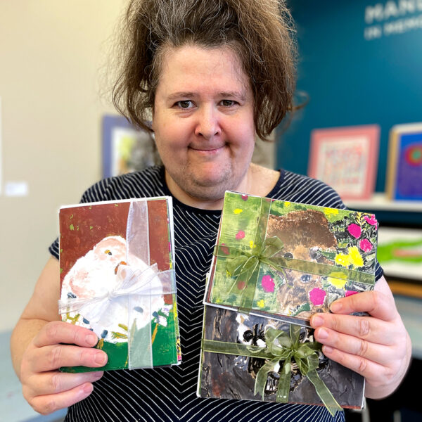 Shantell holding her greeting card sets