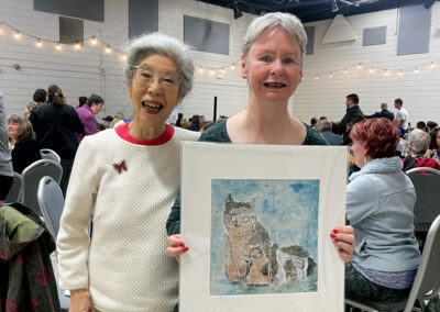 Yoko and Cathy holding a monoprint by Cathy