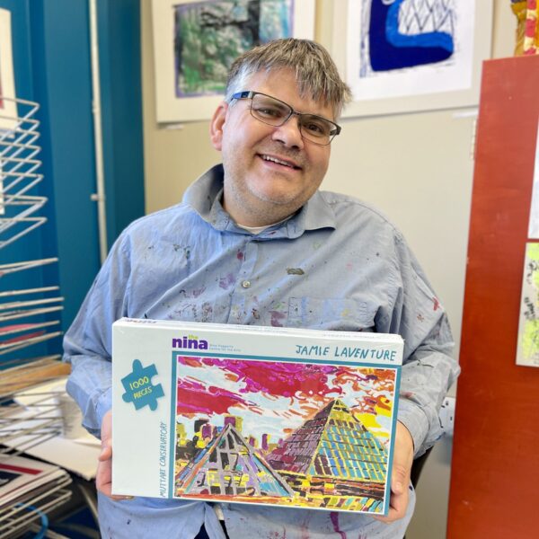 Jamie holding his puzzle