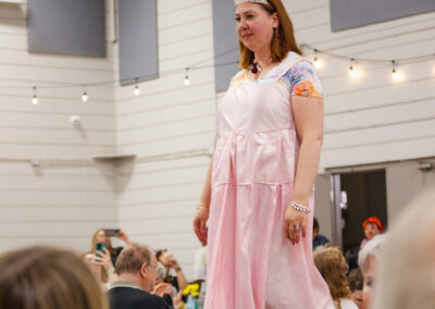 Sophie on the runway in the pink dress she made